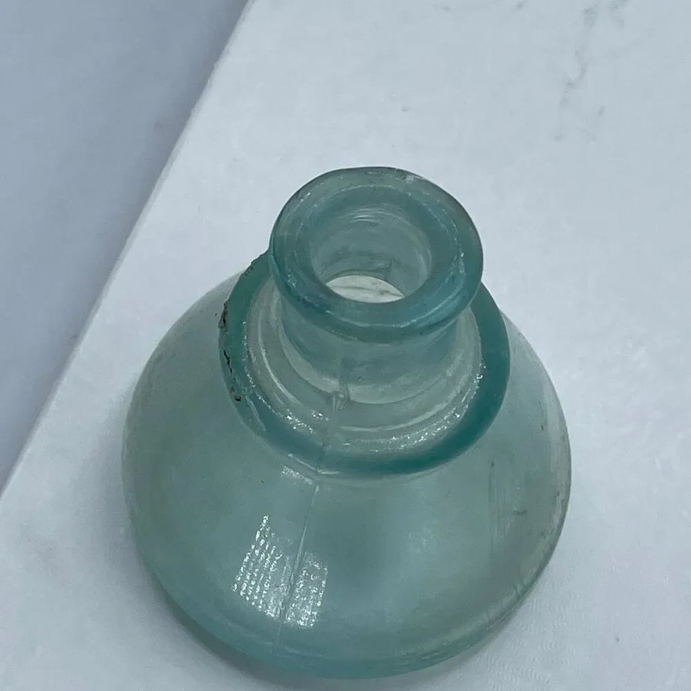 Antique Aqua -colored glass ink bottle Victorian era. Conical or umbrella shaped